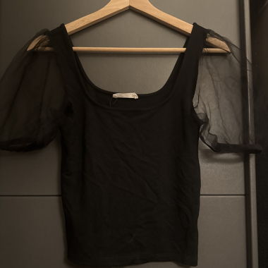 Black top with sheer sleeves
