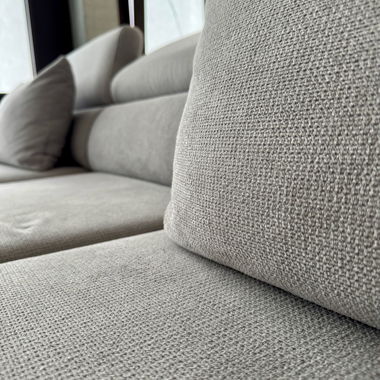 Canapé d'angle gris avec fonction couchage et coffre à literie