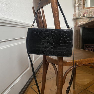 Black faux leather handbag