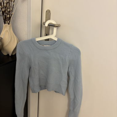 Pull court bleu clair