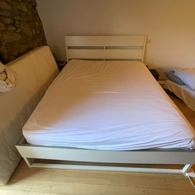 White bed with slatted base