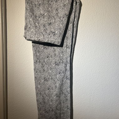 Flowing trousers with black and white floral print