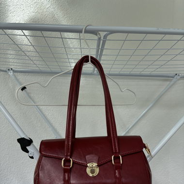 red bag with gold details