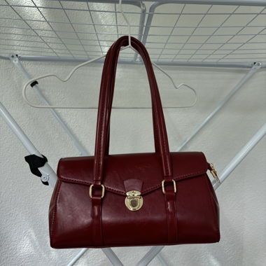 red bag with gold details