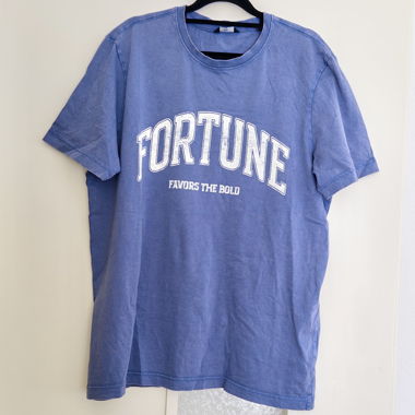 T-shirt C&A azzurro chiaro con stampa bianca