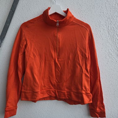 Top arancione H&M Sport con zip