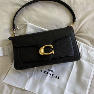 Coach-Clutch in schwarzem Leder