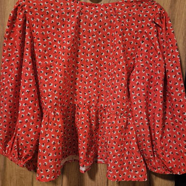 Blusa peplum floreale rossa