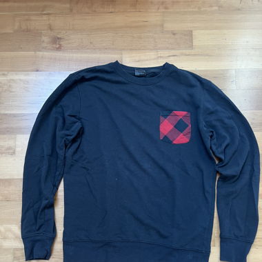 Pull avec poche en chemise à carreaux