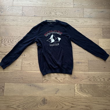 Black sweater with mountain pattern