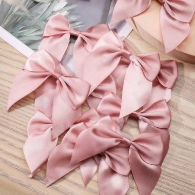 Nœuds en satin rose pour bricolage/déco
