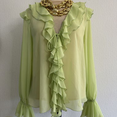 Transparent green blouse with ruffle collar