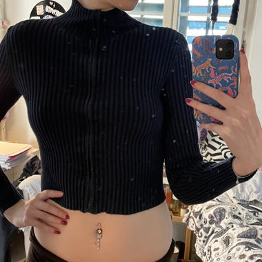 Top nero a coste con zip M/S