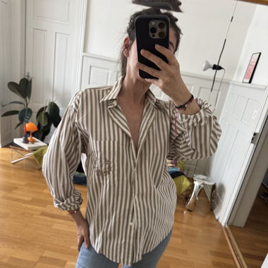 Minimalistic striped blouse with an embroidery 