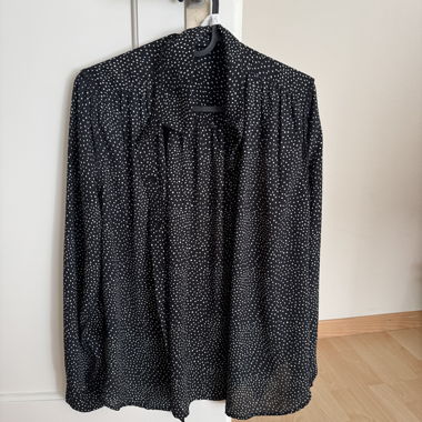 Black blouse with white polka dot pattern