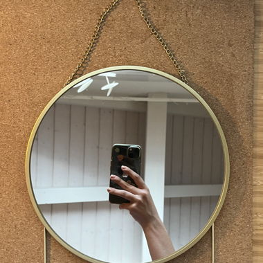 Round gold wall mirror