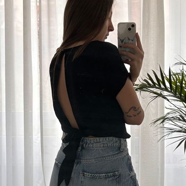 Black Terranova blouse with an open back