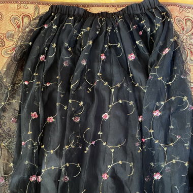 Black skirt with floral applications