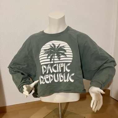 grüner Pullover