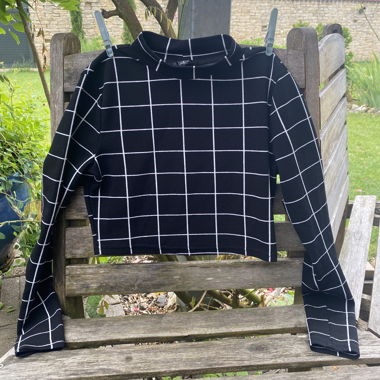 Pull en maille à carreaux noir et blanc