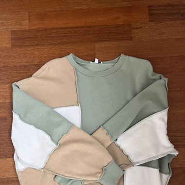 subdued patch sweater 