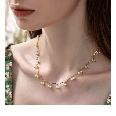 Collana di perle dorate