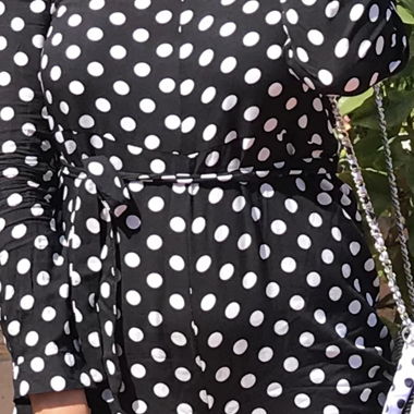 Jumpsuit with white polka dots and tie belt