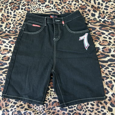 Black denim shorts with dice print