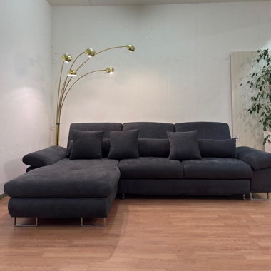 Corner sofa with bed function and all cushions