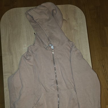 Gillet à capuche H&M couleur pêche.
