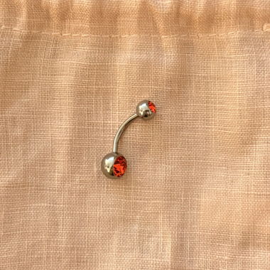 Piercing all’ombelico con pietre arancioni NUOVO