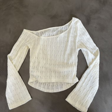 Top asimmetrico crema