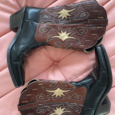 Brown and black cowboy boots