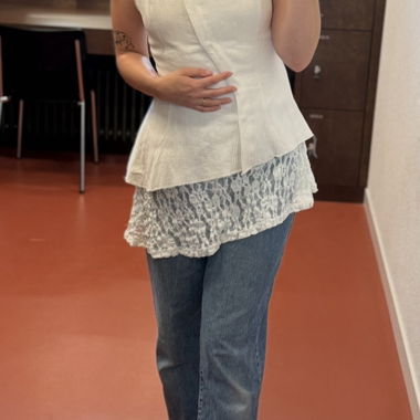 White sleeveless vest with asymmetrical closure