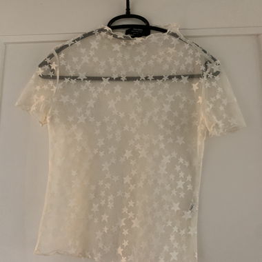 Top in rete stella beige BERSHKA S