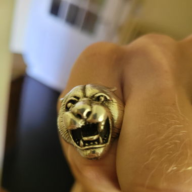 Lion and flute player silver ring