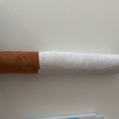 Braun-weisse Plueschruecke