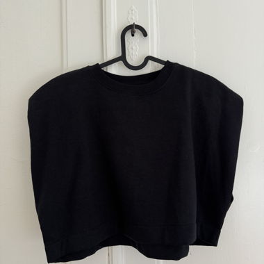 Pull oversize noir sans manches 