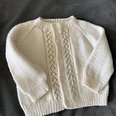 Cardigan per neonato lavorato a mano 100% lana merino