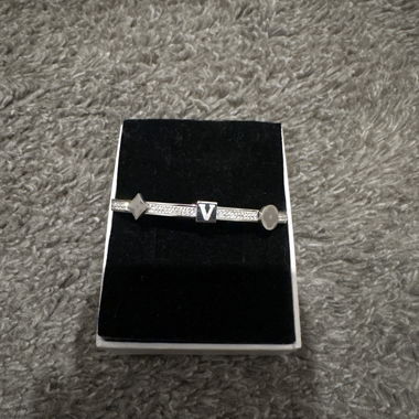 Silver-coloured bracelet with studs
