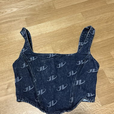 Top in jeans con zip