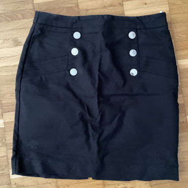 Black mini skirt with button placket