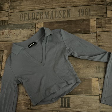 long-sleeved top with purple neckline