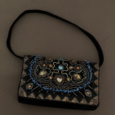 Clutch bag with charms