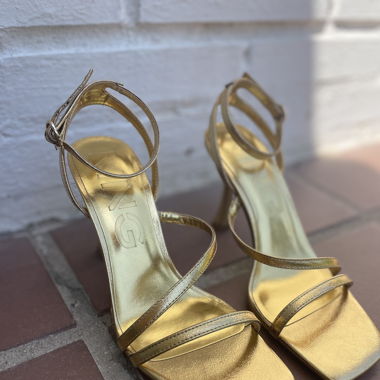 Golden high heel sandals. Mango