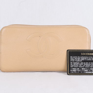 Portefeuille CHANEL Auth en cuir Caviar beige.