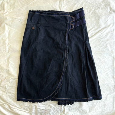 “Case sensitive” belt detailing raw wrap skirt