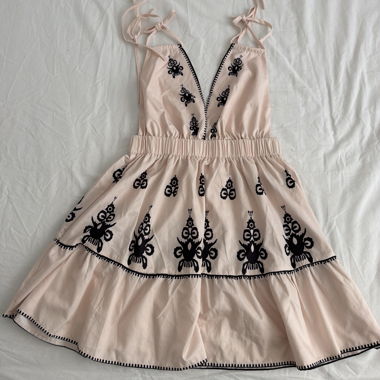 Pink-and-white dress with black embroidery