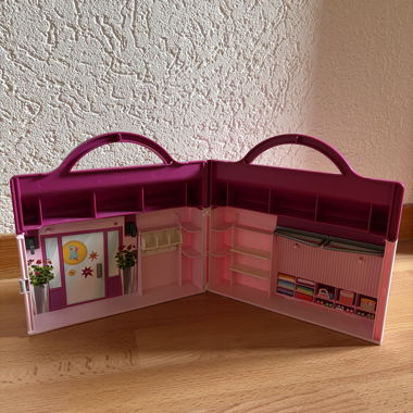 Pink Playmobil toy suitcase