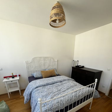 White metal bed with mattress in Geneva